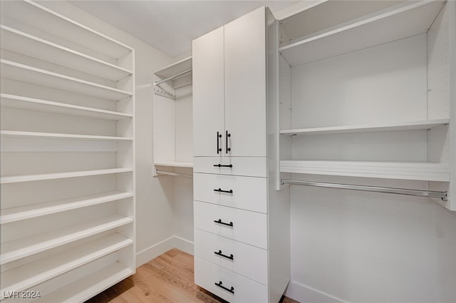 walk in closet featuring light hardwood / wood-style floors