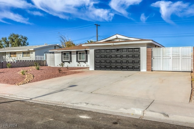 ranch-style home featuring a garage