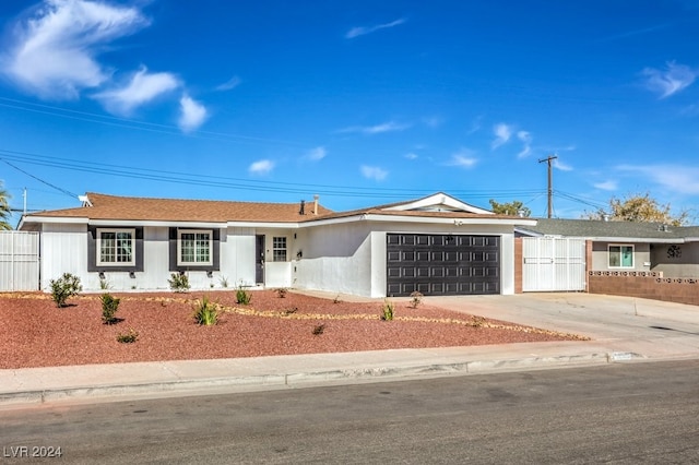 single story home featuring a garage