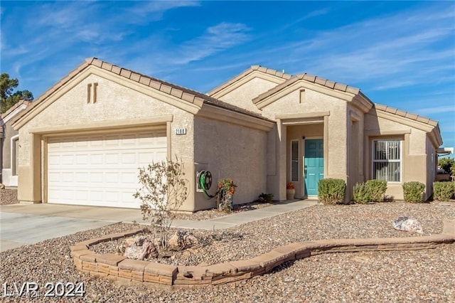 single story home with a garage