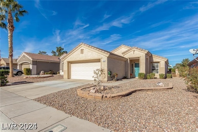 ranch-style home featuring a garage