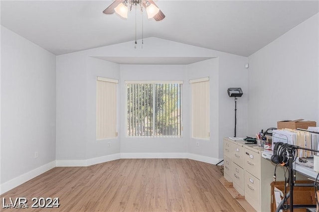 unfurnished office with light wood-type flooring, ceiling fan, and lofted ceiling