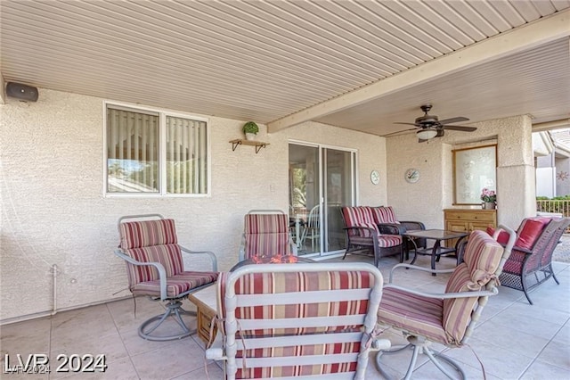 view of patio featuring an outdoor living space and ceiling fan