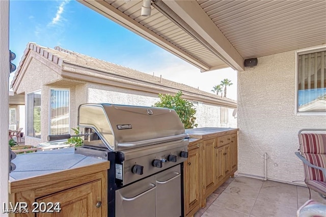 view of patio featuring a grill