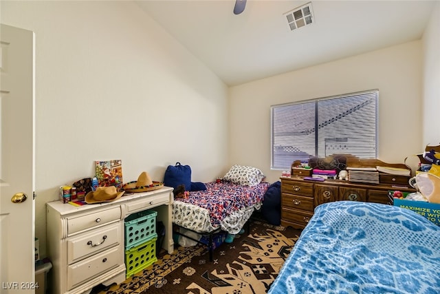 bedroom featuring ceiling fan, lofted ceiling, and dark wood-type flooring