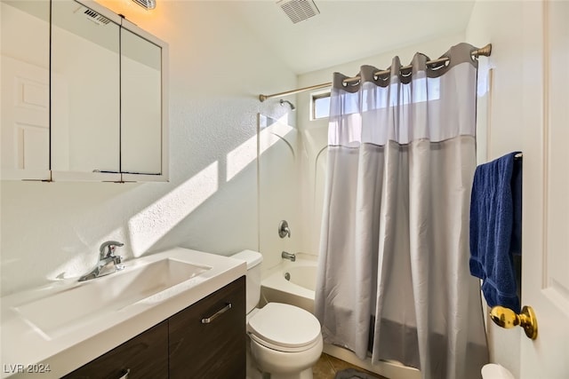 full bathroom featuring tile patterned floors, shower / bath combination with curtain, toilet, and vanity