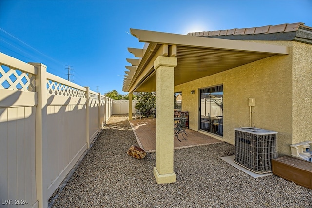 view of yard with a patio area and central AC