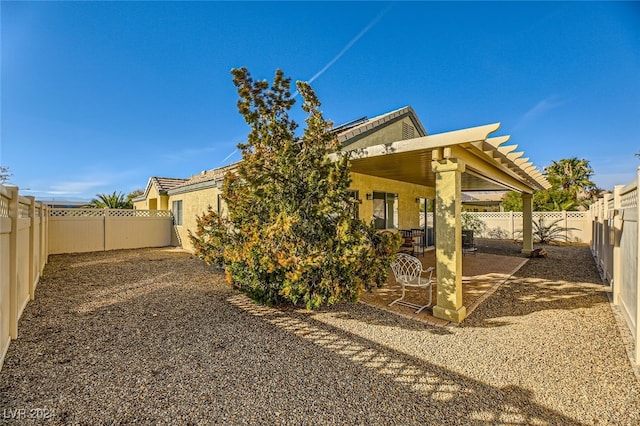 rear view of property featuring a patio area