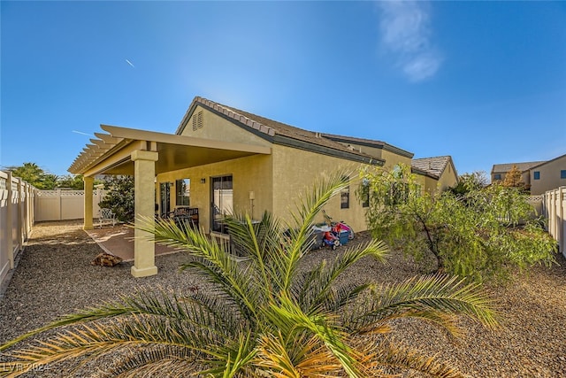 rear view of house with a patio area