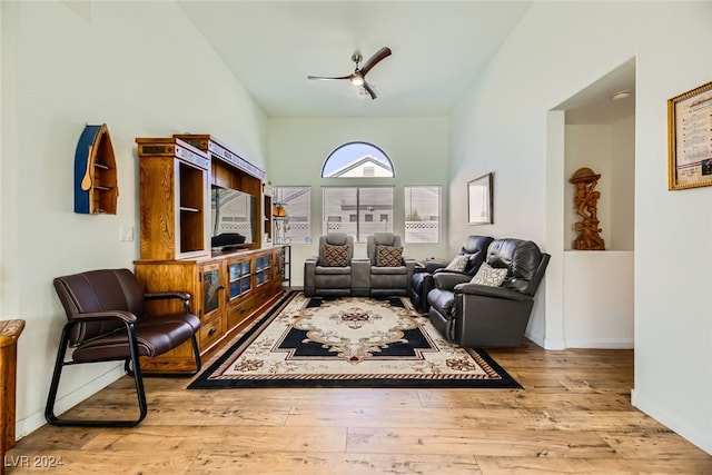 living area featuring ceiling fan and light hardwood / wood-style floors