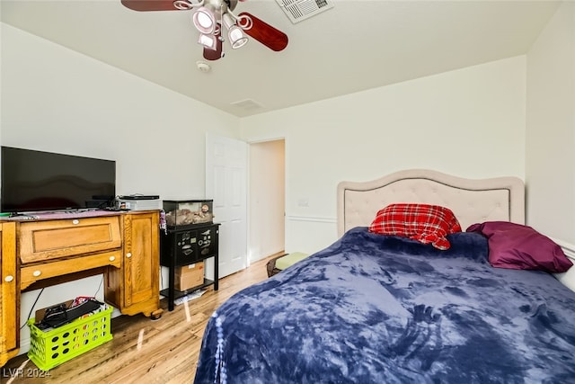 bedroom featuring light wood-type flooring and ceiling fan