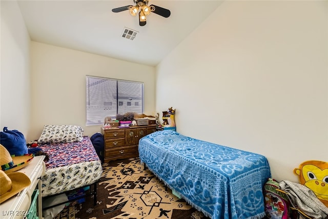 bedroom featuring ceiling fan and vaulted ceiling