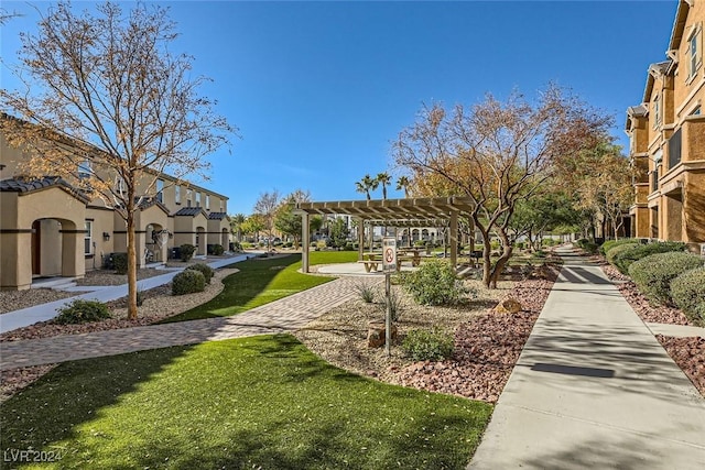 surrounding community with a pergola and a lawn