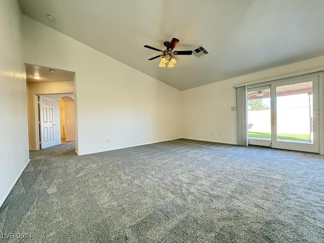 carpeted empty room featuring ceiling fan and vaulted ceiling