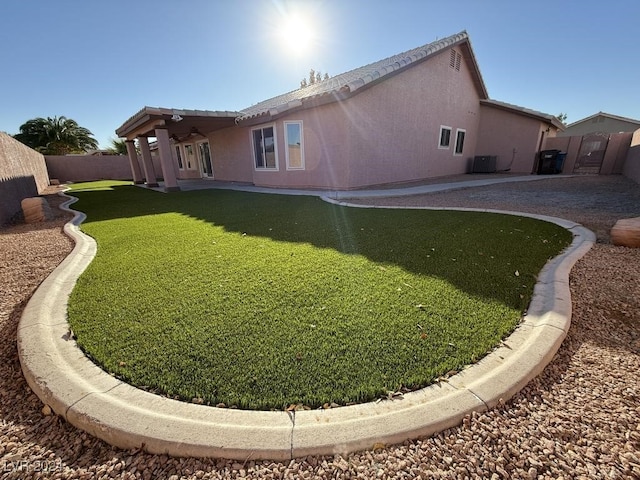 back of property with a patio and cooling unit