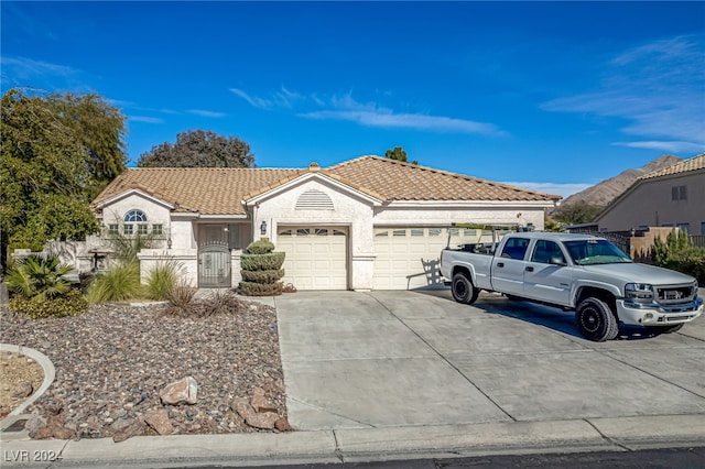 single story home featuring a garage