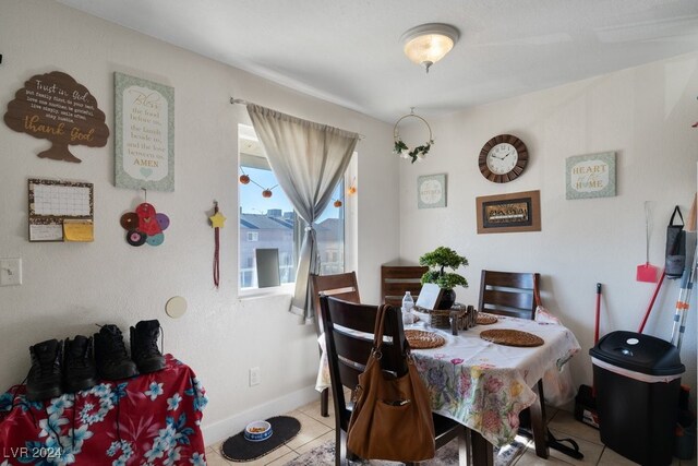 4740 Corsaire Ave, Las Vegas, NV 89115 - dining room featuring light tile patterned flooring and baseboards