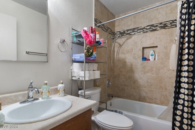 4740 Corsaire Ave, Las Vegas, NV 89115 - bathroom with toilet, shower / bathtub combination with curtain, vanity, and a textured wall