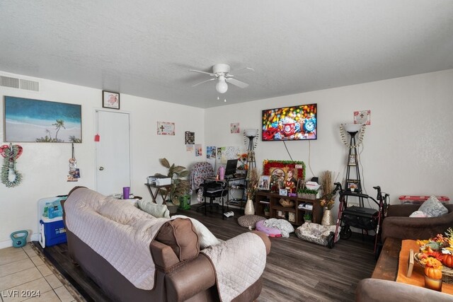 4740 Corsaire Ave, Las Vegas, NV 89115 - living room featuring a ceiling fan and wood finished floors