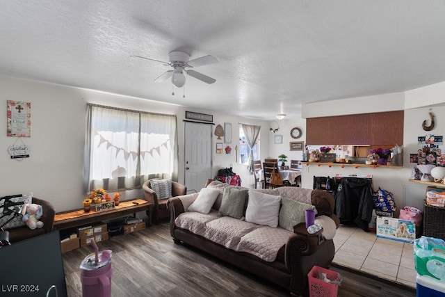 4740 Corsaire Ave, Las Vegas, NV 89115 - living area with a ceiling fan, wood finished floors, and a textured ceiling