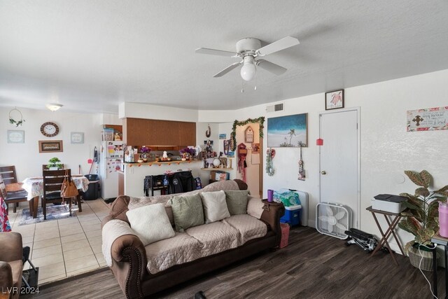 4740 Corsaire Ave, Las Vegas, NV 89115 - living room featuring a ceiling fan and wood finished floors