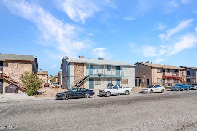 4740 Corsaire Ave, Las Vegas, NV 89115 - view of building exterior featuring stairway and a residential view
