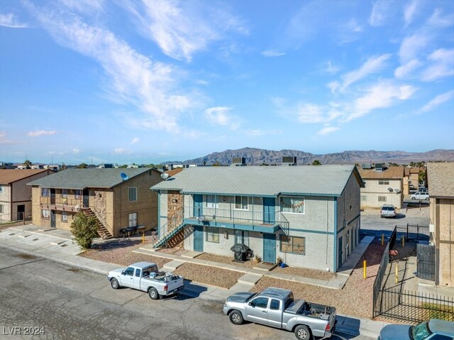 4740 Corsaire Ave, Las Vegas, NV 89115 - view of front of house featuring a residential view, stairs, and a mountain view