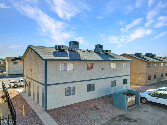 4740 Corsaire Ave, Las Vegas, NV 89115 - back of property with stucco siding and central air condition unit