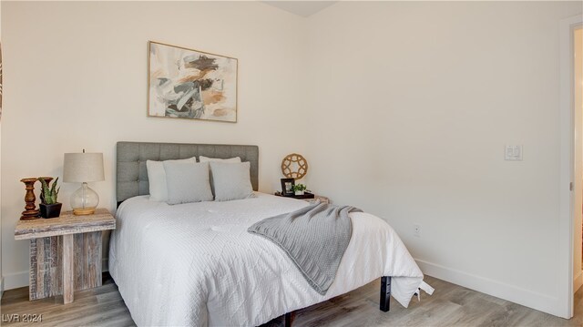 bedroom with hardwood / wood-style floors