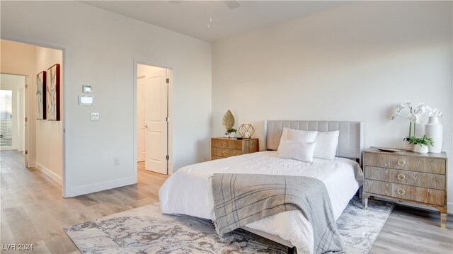 bedroom featuring ceiling fan and hardwood / wood-style flooring