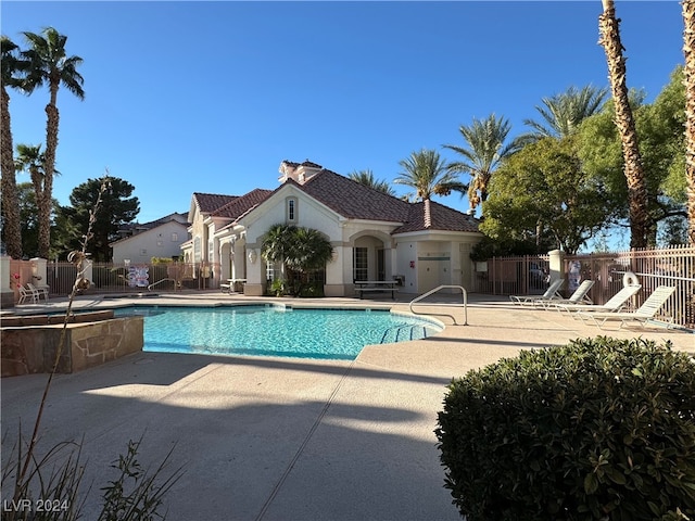 view of swimming pool with a patio area