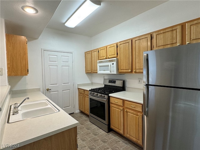 kitchen featuring appliances with stainless steel finishes and sink