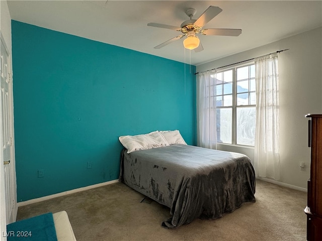 carpeted bedroom featuring ceiling fan