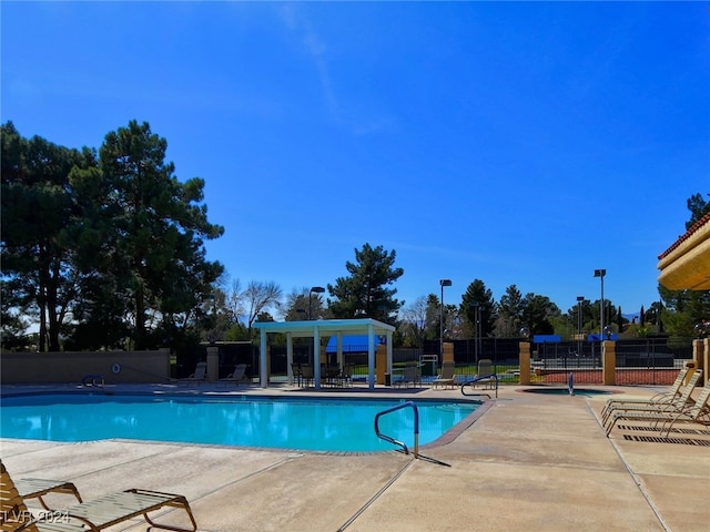 view of swimming pool with a patio