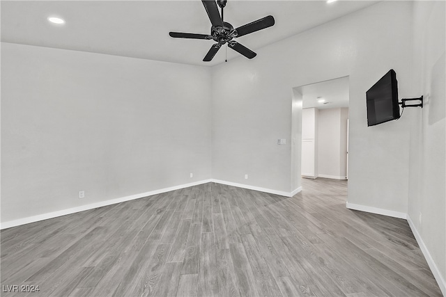 spare room with ceiling fan and light hardwood / wood-style floors