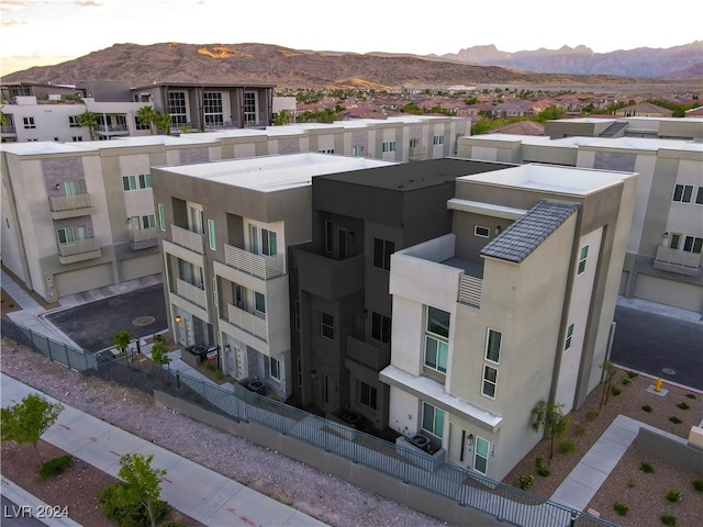 birds eye view of property with a mountain view