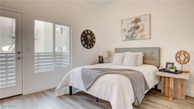 bedroom with hardwood / wood-style flooring