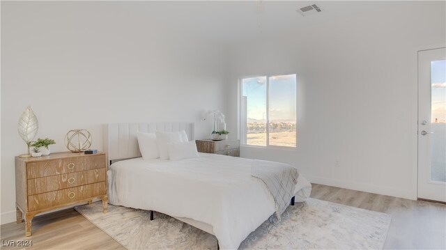 bedroom with light hardwood / wood-style flooring