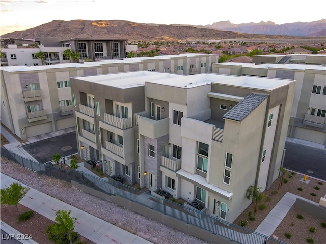 birds eye view of property with a mountain view