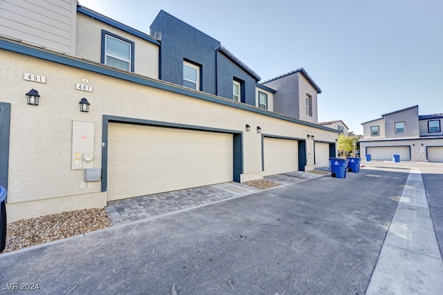 view of property exterior featuring a garage