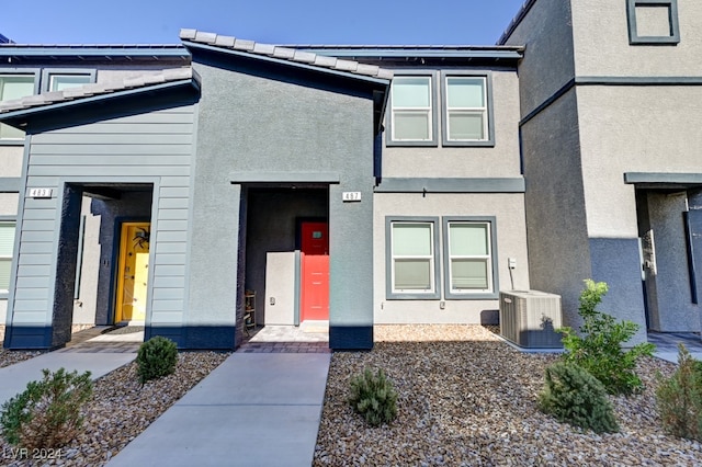 view of front of home featuring cooling unit