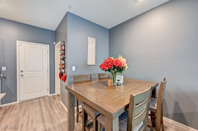 dining room with light hardwood / wood-style flooring