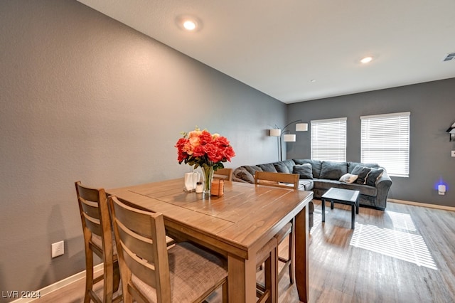 dining area with light hardwood / wood-style flooring