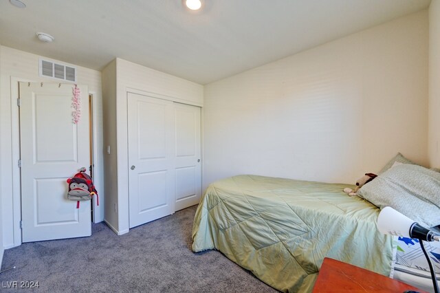 bedroom with carpet floors and a closet