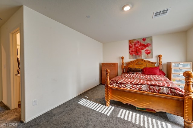 bedroom with dark carpet