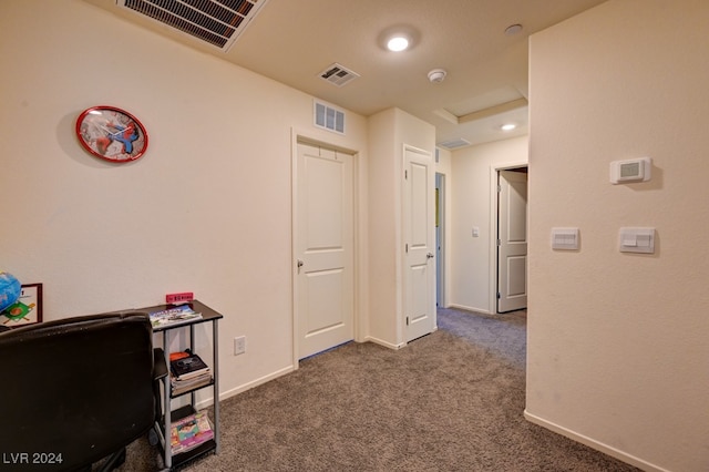 hallway featuring dark carpet