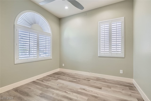 spare room featuring ceiling fan and light hardwood / wood-style floors