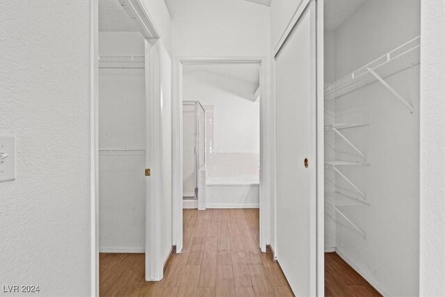 spacious closet with wood finished floors