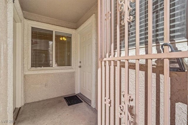 entrance to property featuring stucco siding