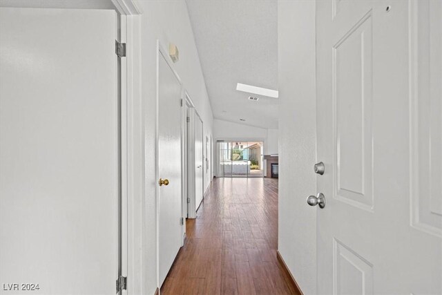 hallway with dark wood-style flooring